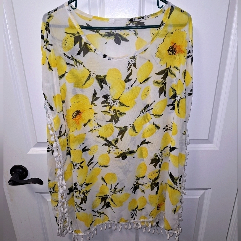 A beach Cover-up featuring lemons and hibiscus blooms. Unbranded.